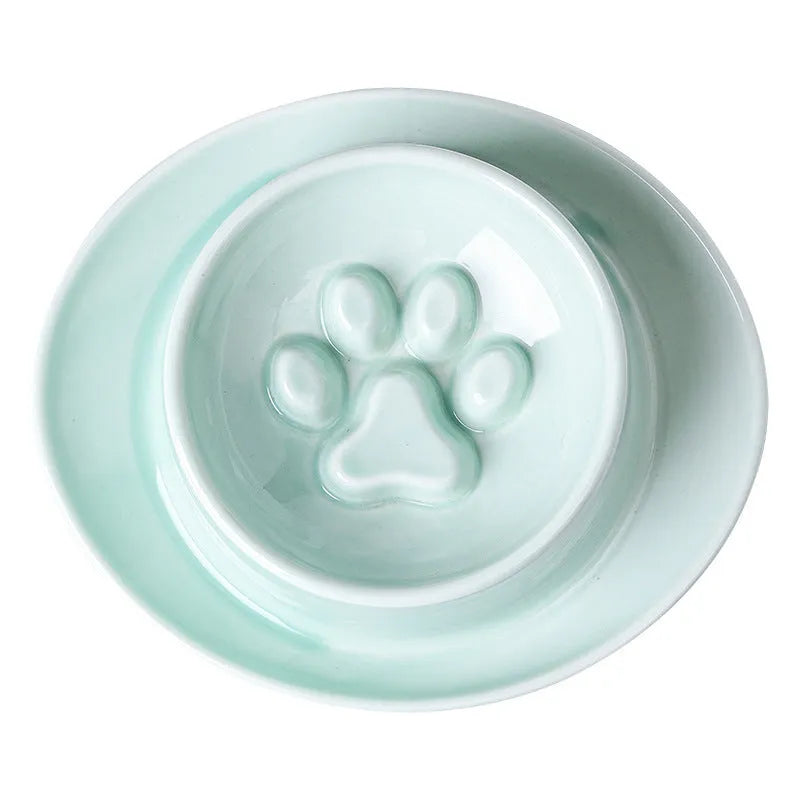 Green ceramic slow feeder pet bowl with anti-choke basin and neck protection design.