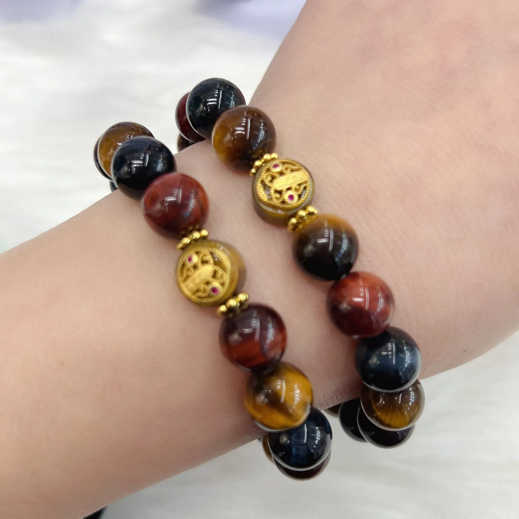 Brown tigereye stone round beads on Maillard chain bracelet showing natural banding patterns