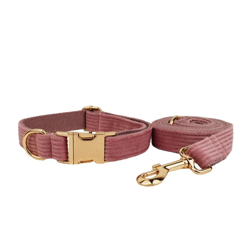 Red corduroy dog collar and matching traction rope set with vest, bow, and poop bag accessories
