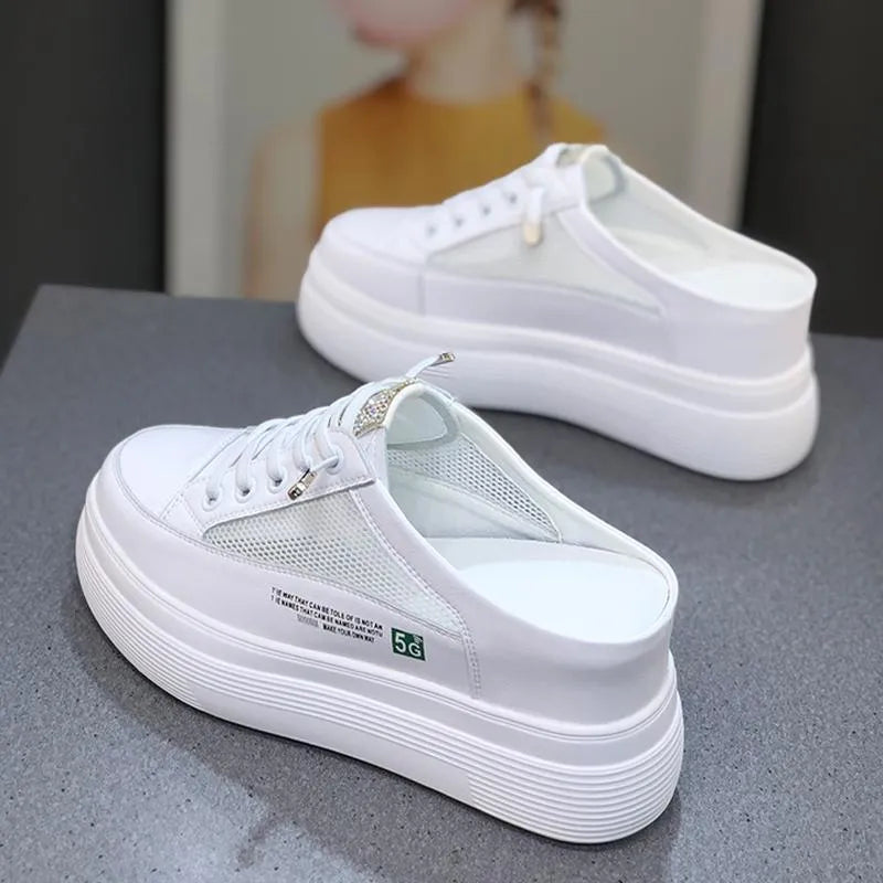 White women's casual platform shoes with mesh surface and heel-free design on a rubber sole.