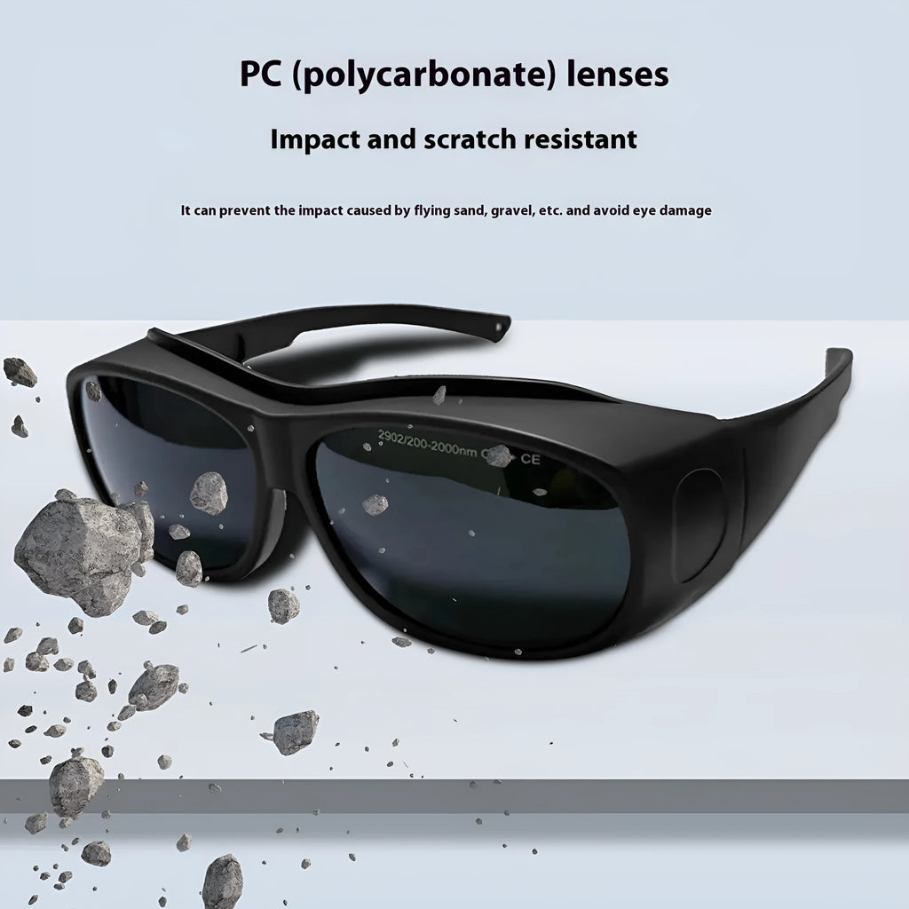 A pair of clear polycarbonate laser safety goggles for welding and skin treatment protection.
