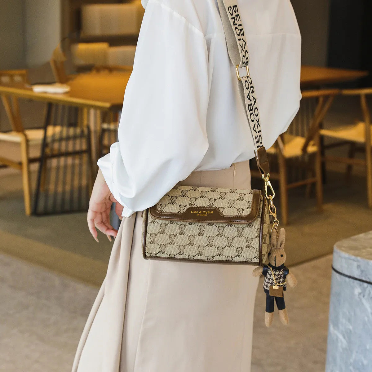 Khaki canvas square shoulder bag with cute bear design, woven letter and stitching details, 21x13x10cm