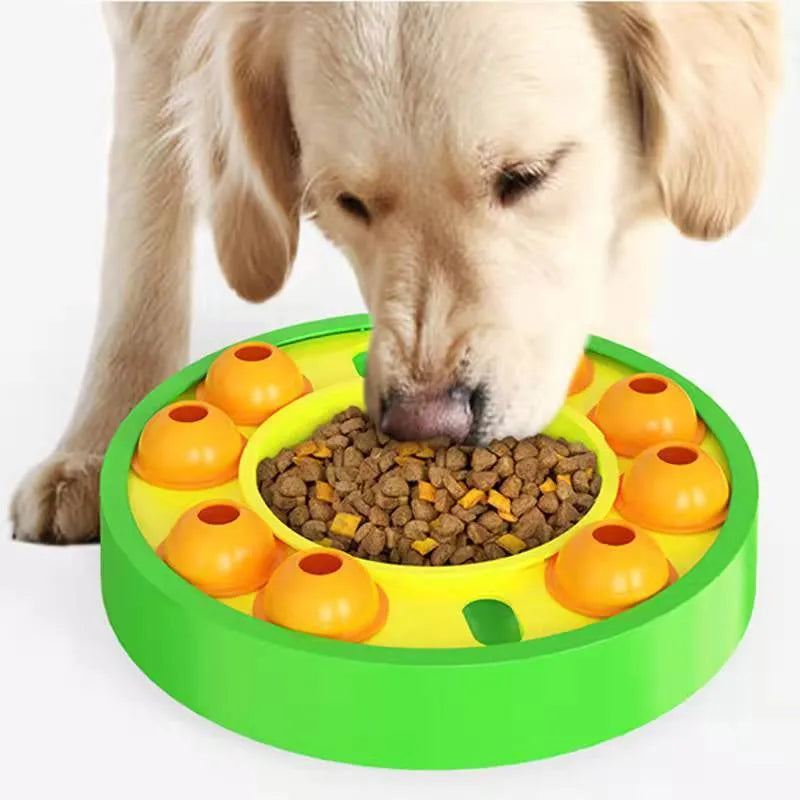 Round blue interactive dog slow feeder puzzle toy with central column and food turntable on a table