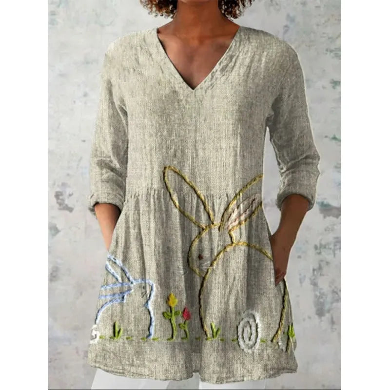 Women's loose floral print dress with wide waist and 3/4 length wave-pattern sleeves.