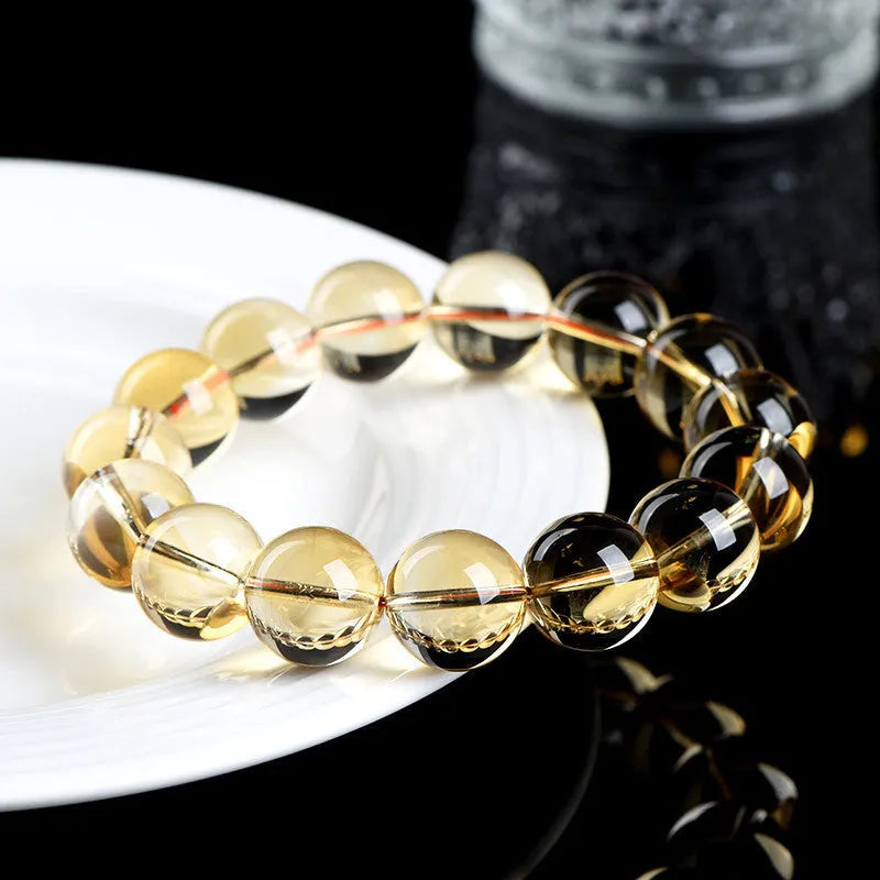Natural citrine scattered beads ball bracelet on wrist, showing polished beads in 7A grade colour.