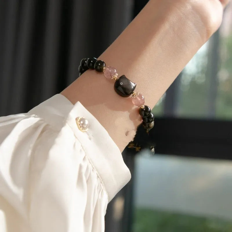 Black obsidian bracelet with 8mm beads and silver cat charms on stretch cord