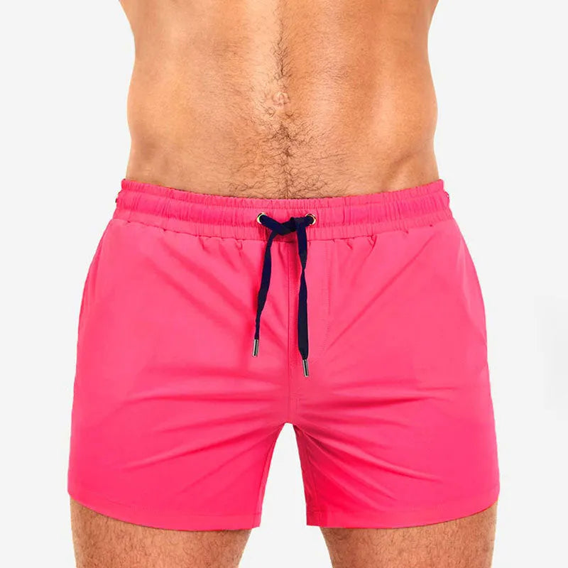 Mesh-lined sports shorts in polyester fabric showing colour options