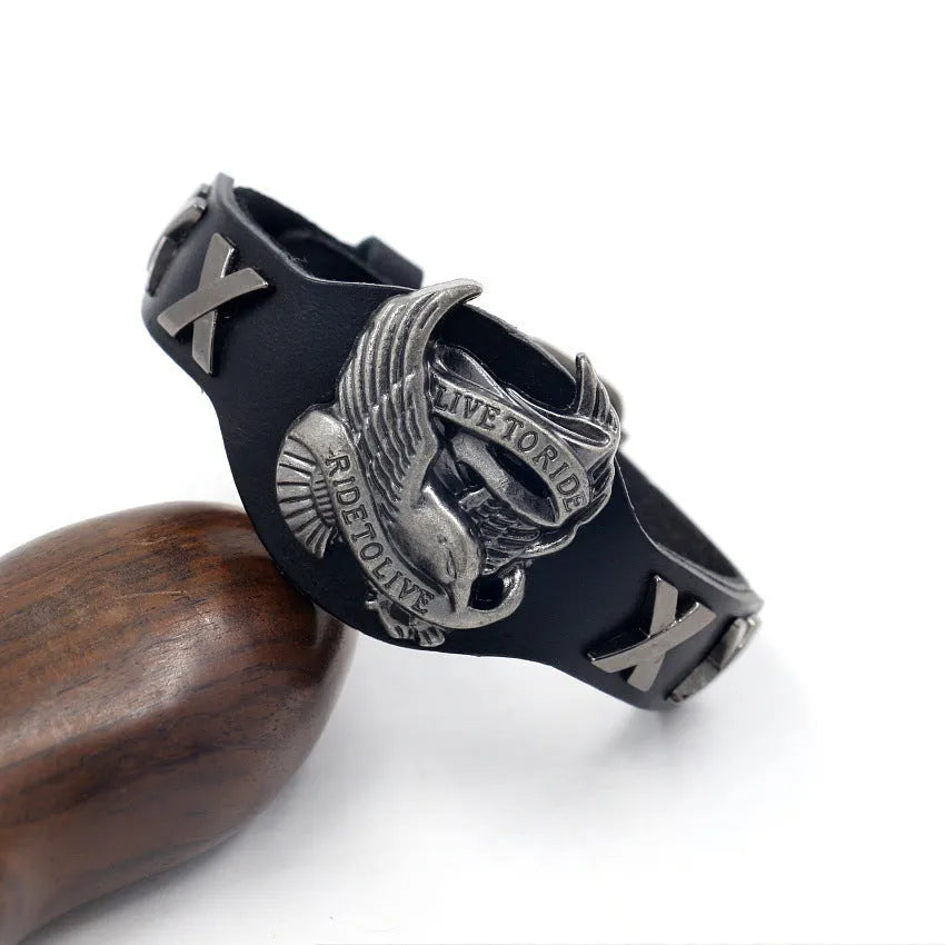 Black geometric leather wrist bracelet with detailed alloy eagle clasp showing tapered width design
