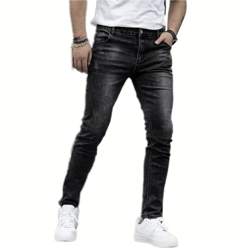 Men's straight-leg stretch jeans in black, dark blue, or grey, showing skinny leg opening and mid-waist fit.