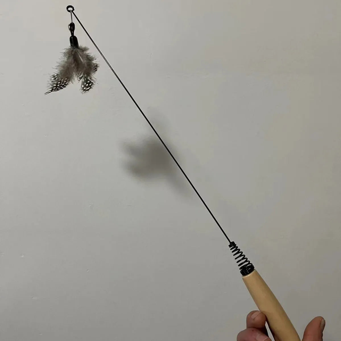 Wooden handle cat teasing stick with feather bell heads in multiple colours
