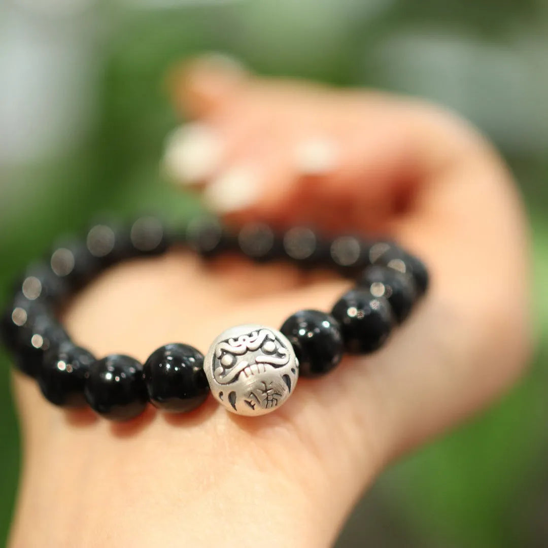 Handmade black agate bead bracelet with sterling silver on a wrist