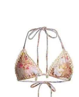 Women's creamy-white floral bikini set with separate skirt on beach