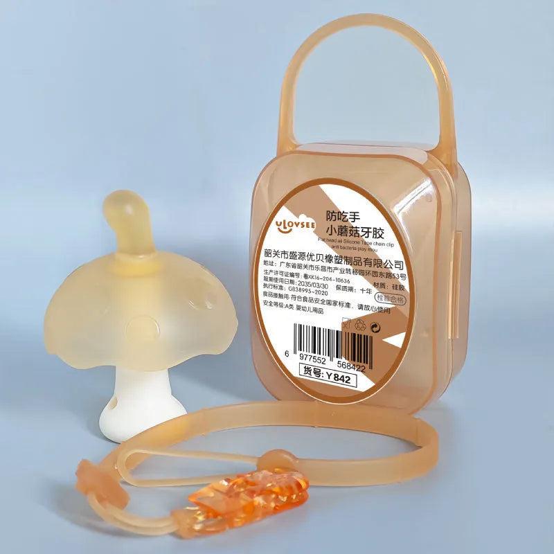 Small pink mushroom-shaped silicone chewy toy with a transparent chain and box.