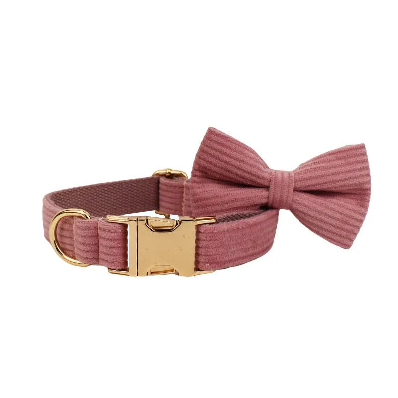 Red corduroy dog collar and matching traction rope set with vest, bow, and poop bag accessories