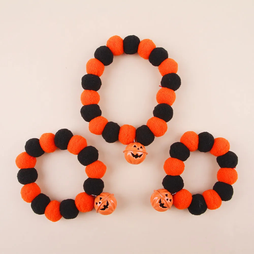 Black Halloween cat collar with pumpkin decoration on adjustable strap