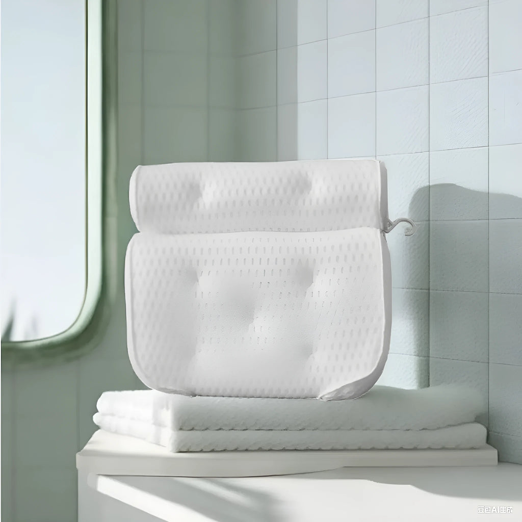 White bathtub pillow with mesh design and suction cups on underside