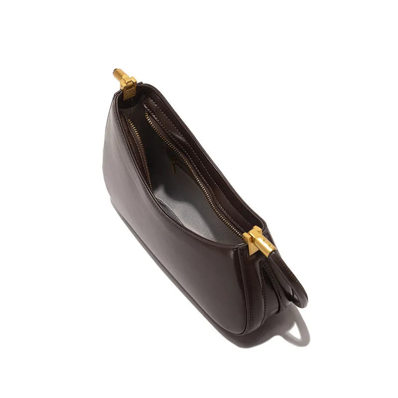 Oval retro commuter underarm handbag in PU leather available in seven colours with single shoulder strap