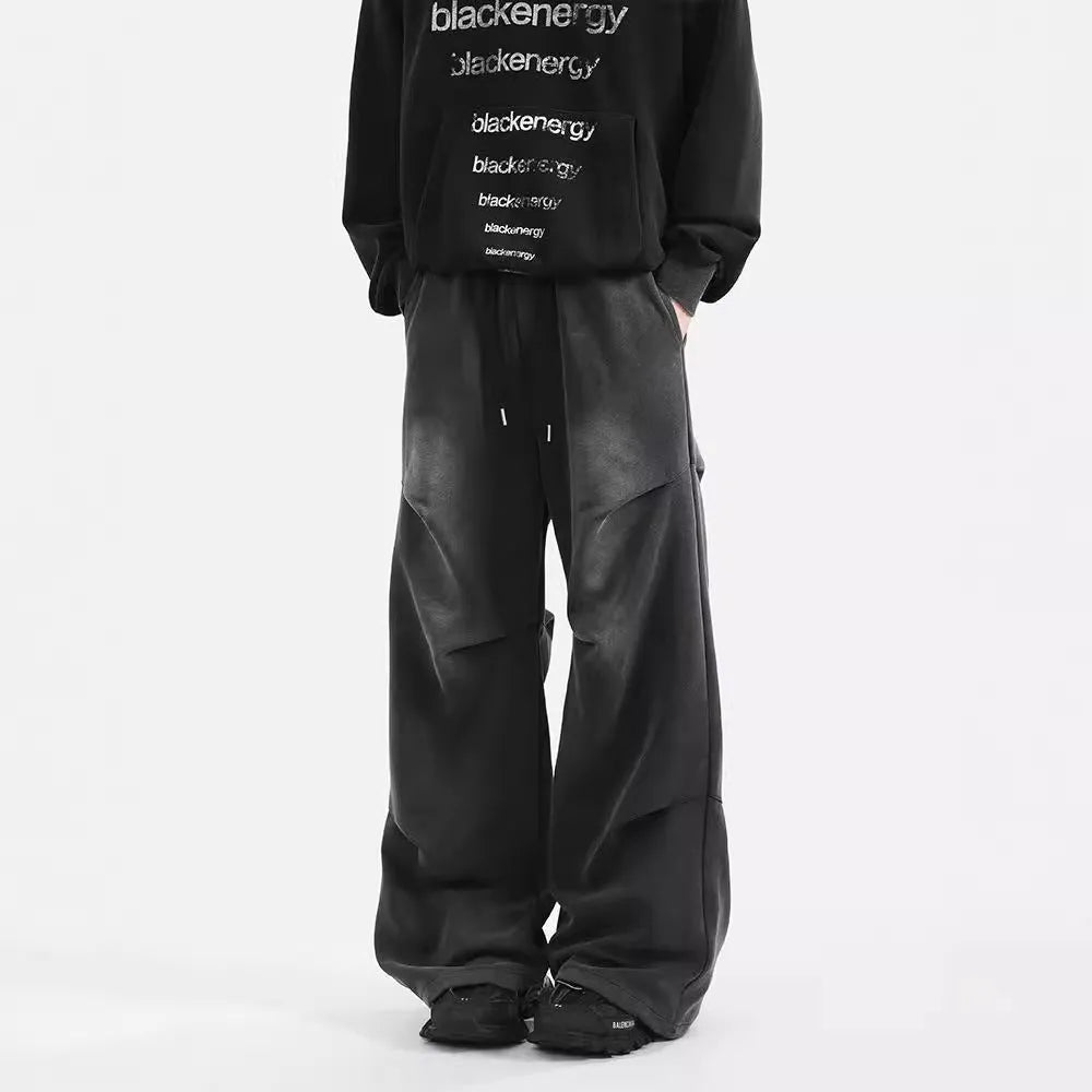 Men's pleated straight loose sweatpants in black and grey, cotton fabric, elastic waist, American washed finish.