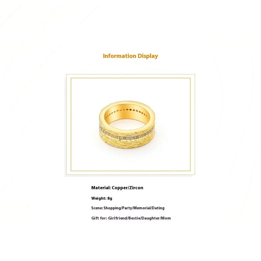 Gold geometric women's zircon ring made from electroplated copper on a grey background.