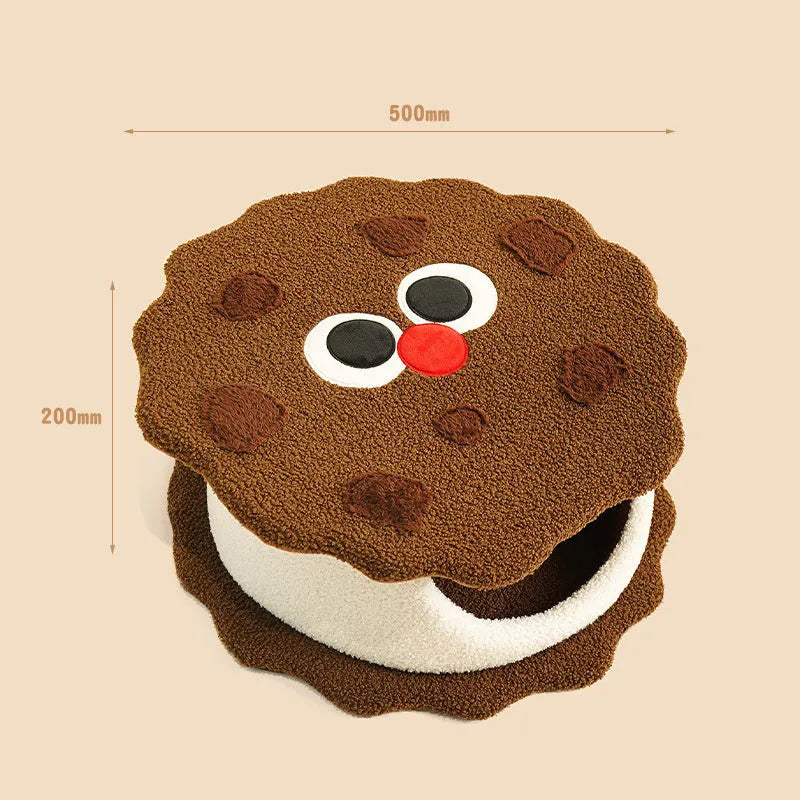 Khaki coloured enclosed cat house with circular entrance, nest-shaped like a sandwich cookie