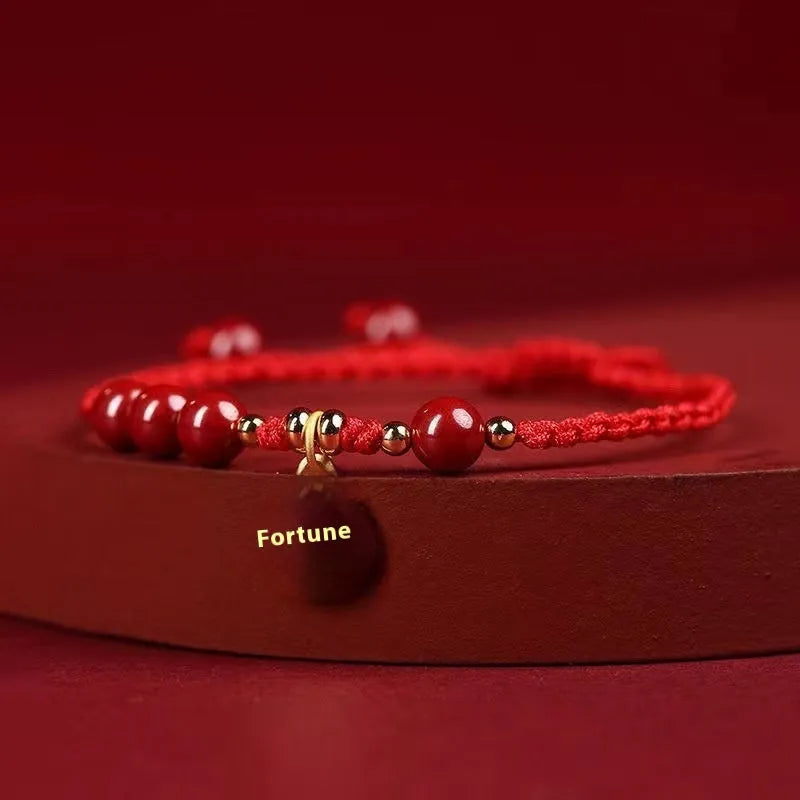 Cinnabar bracelet with braided rope and peach blossom charm for exam luck