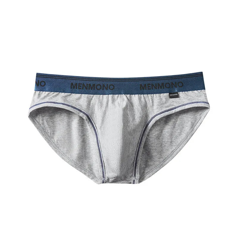 Men's low-waist cotton briefs in a two-tone colour on a solid background.
