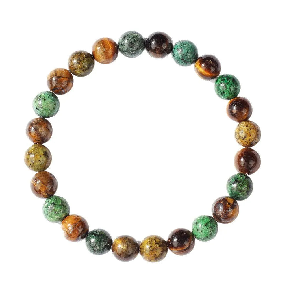 Handmade Tigereye stone bracelet with large flower-shaped bead and adjustable metal clasp on a cord.