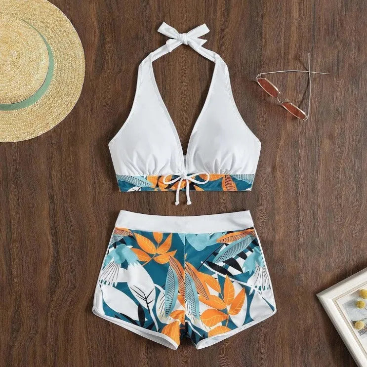 Women's solid colour white split top swimsuit with leaf print boxers bottoms, backless, sleeveless, polyester fabric