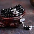 Black agate stone bead bracelet with 108 geometrically shaped beads and number element details