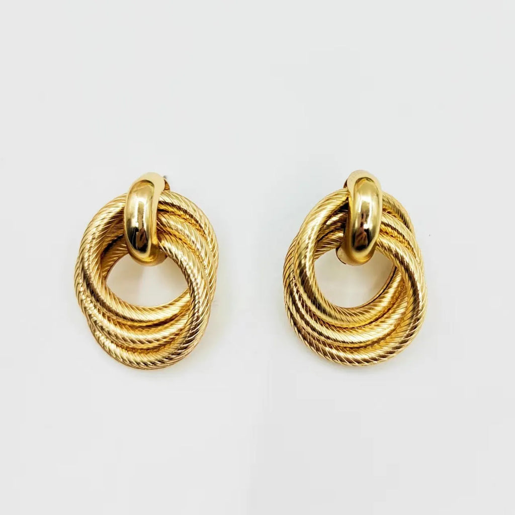 Gold geometric ring embossed twisted stud earrings with exaggerated creative design on metal