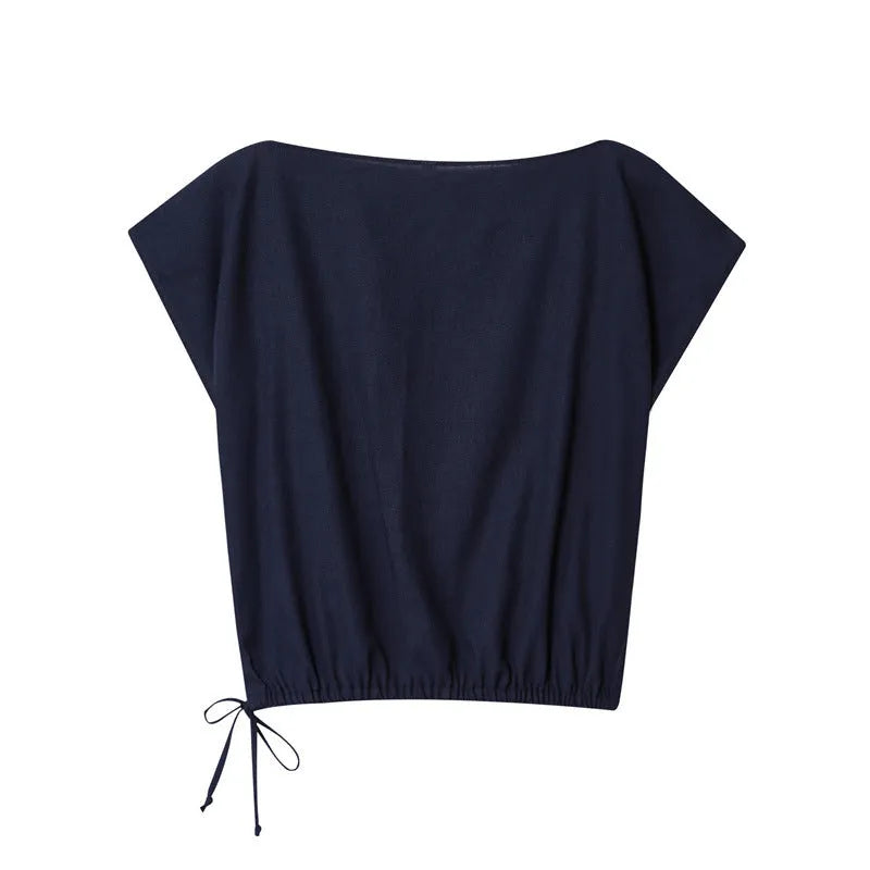 Women's linen blend co-ord set featuring a blouse with flounced sleeves and matching wide leg trousers.