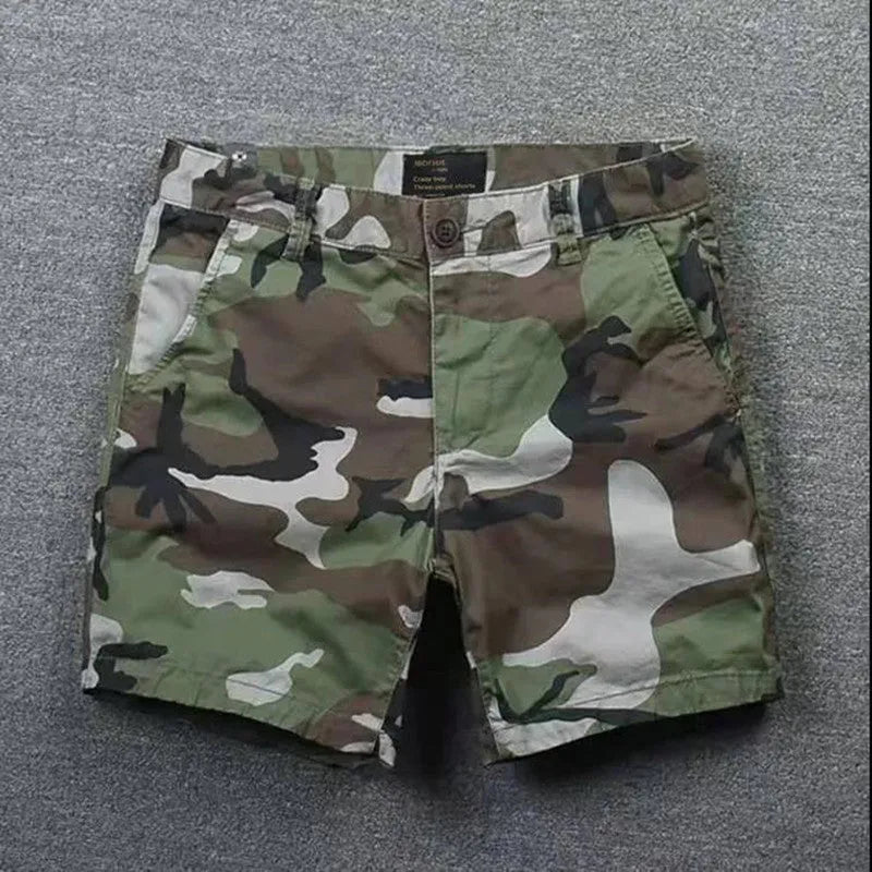 Men's loose cotton shorts in straight-leg cut with zipper fly, shown in camouflage pattern option