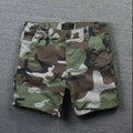 Men's loose cotton shorts in straight-leg cut with zipper fly, shown in camouflage pattern option