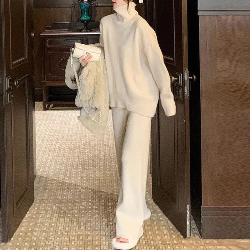 Women's casual two-piece set featuring a long-sleeve sweater and wide-leg trousers in a solid colour.