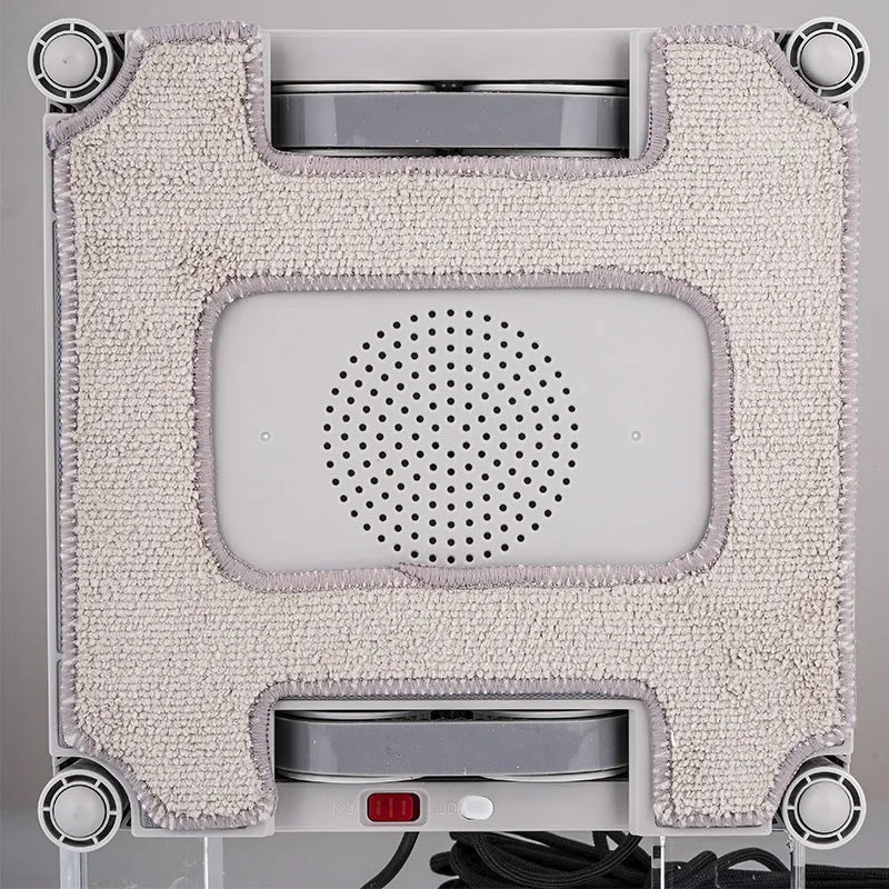 White window cleaning robot with four spray nozzles for automated high-rise window washing