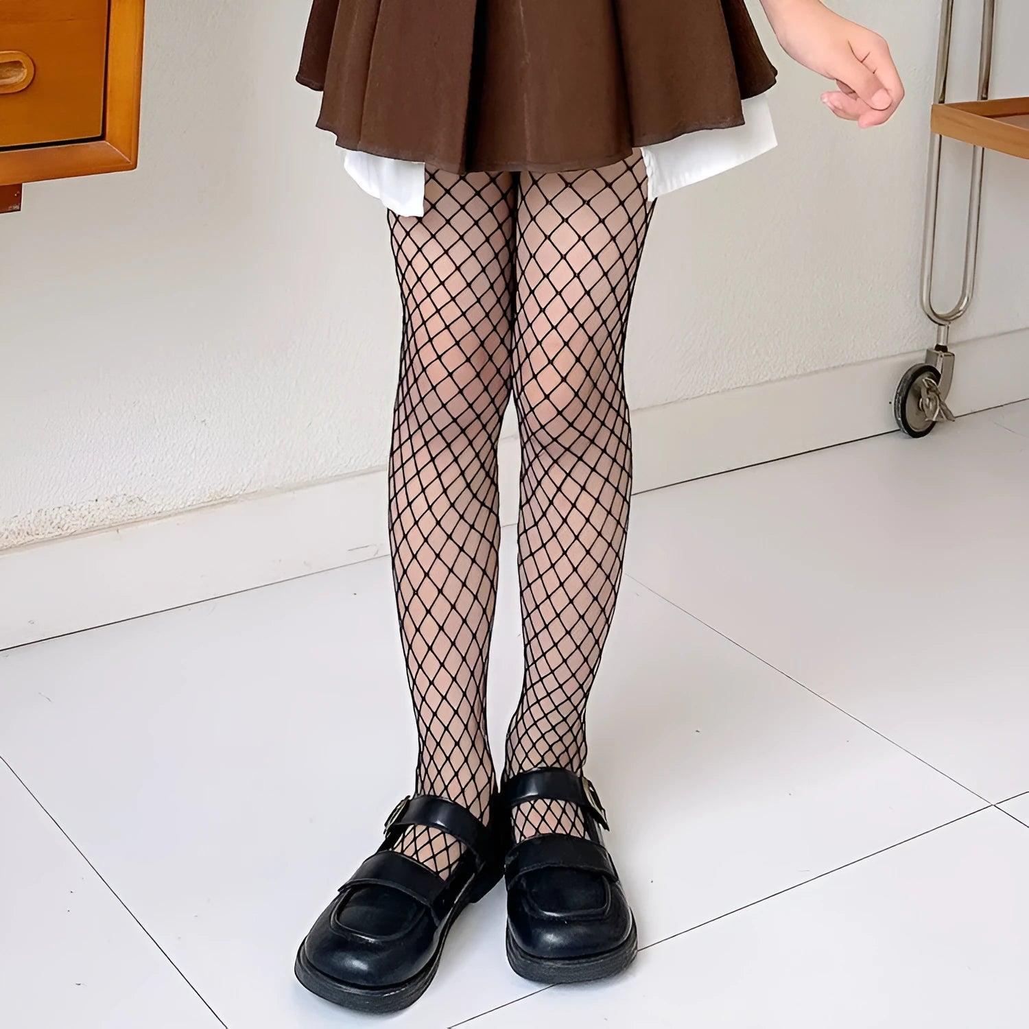 Women's mesh stockings showing large, medium and small hole patterns in black and white colours