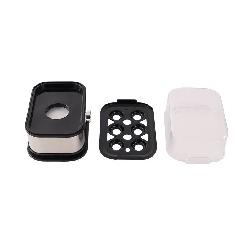 Black stainless steel mini portable electric egg boiler on a countertop
