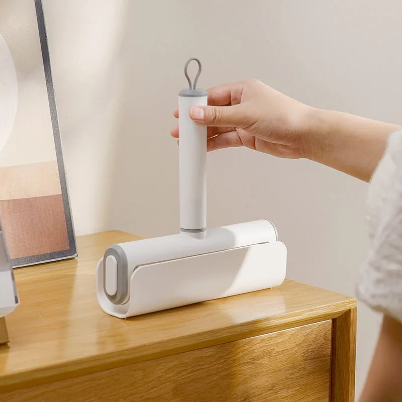 Refillable lint remover roller for picking up cat hair from floors and carpets