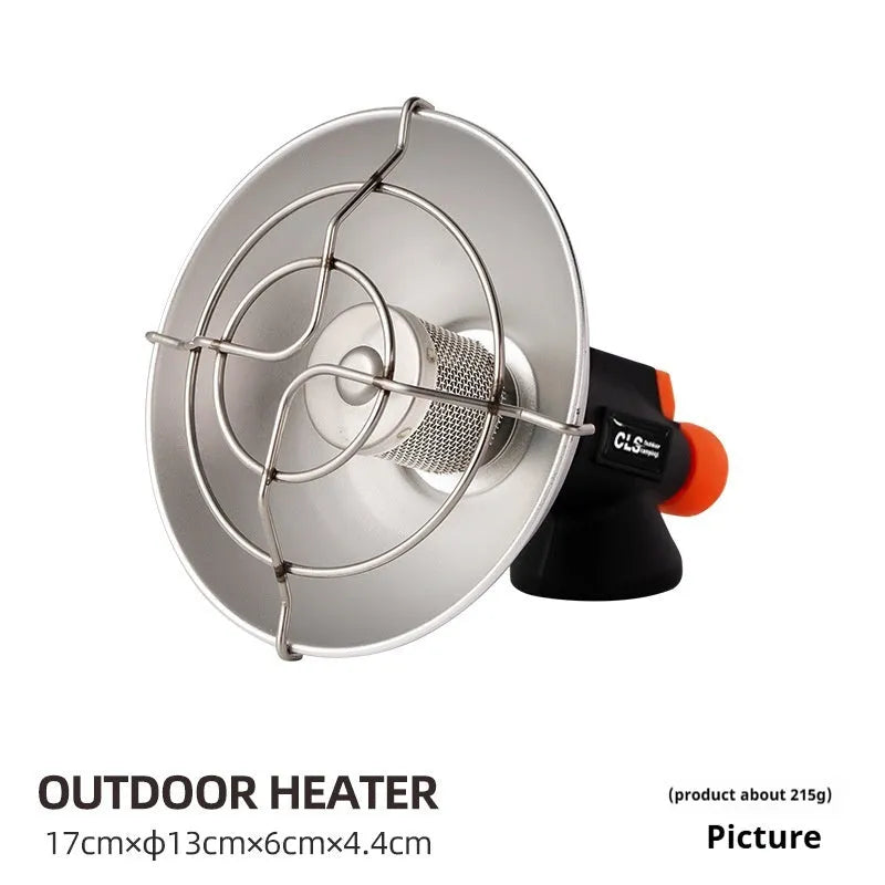 Black and orange portable outdoor heating stove with automatic ignition on a table.