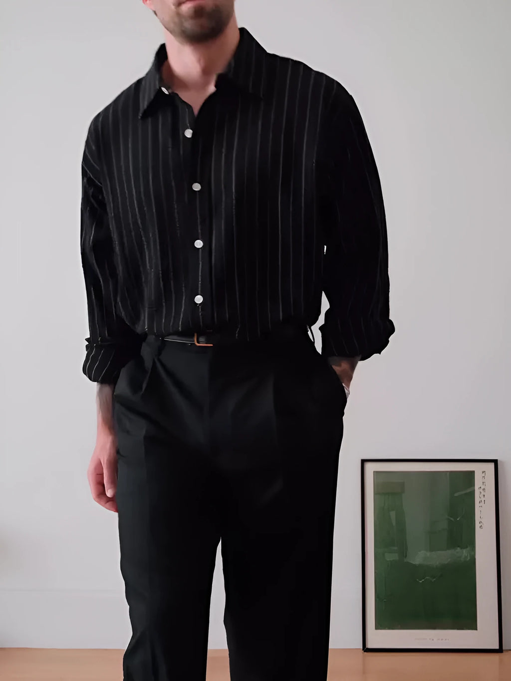 Black pinstriped button-down polyester shirt with regular fit on hanger