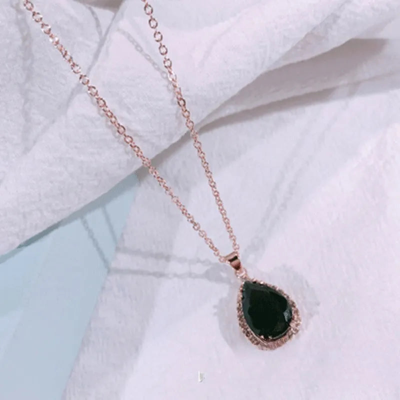Rose gold water drop shaped women's necklace with geometric rhinestone decoration in pink colour