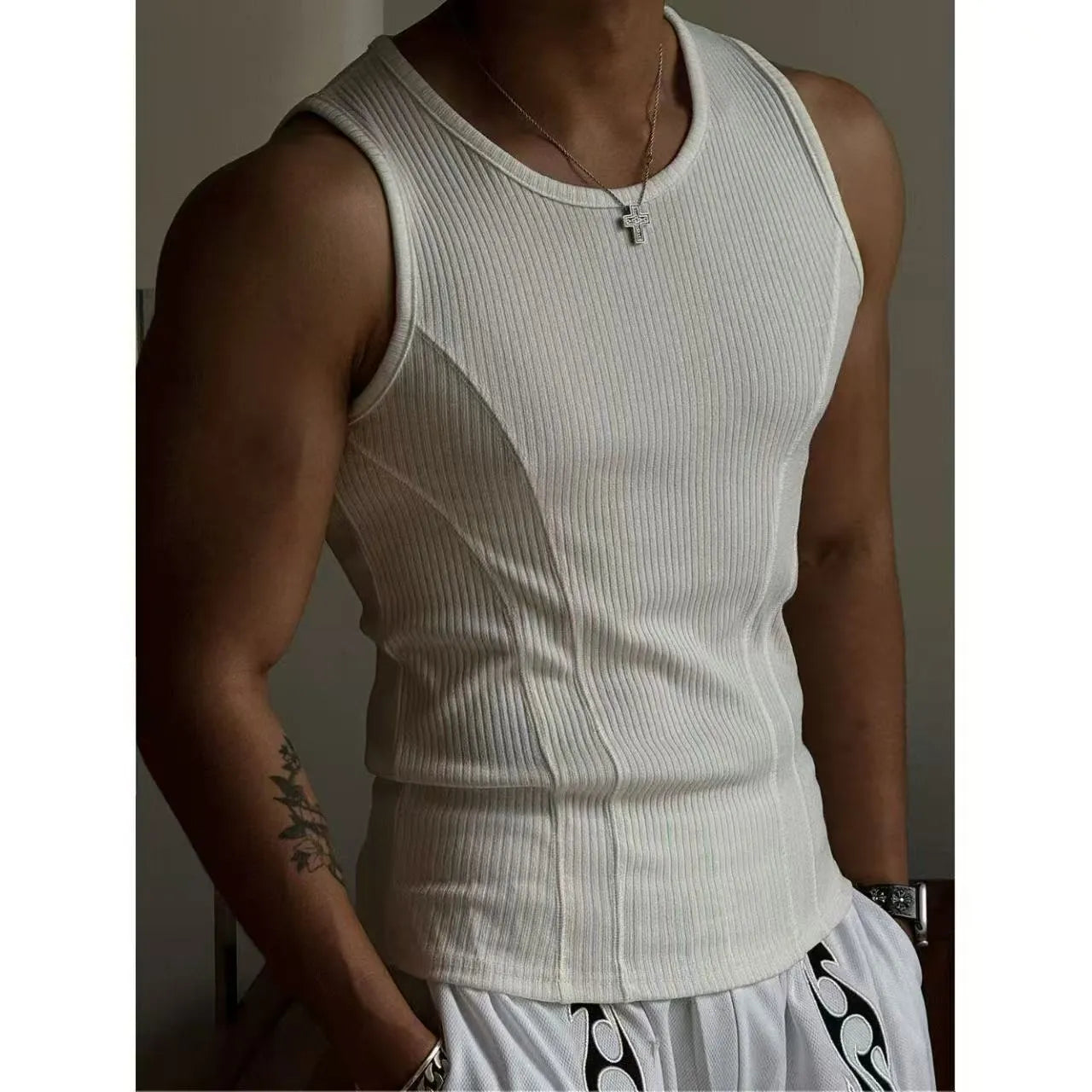 A black men's tight-fitting I-shaped vest tank top for sports, made from polyester.