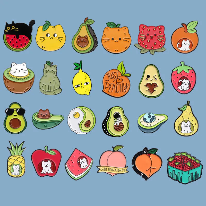Colourful cartoon fruit and letter design metal brooch pin on a white background.