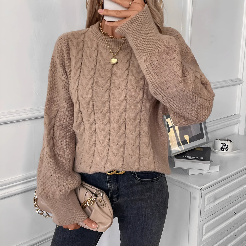 Women's beige casual sweater with a textured twist design and round neck.