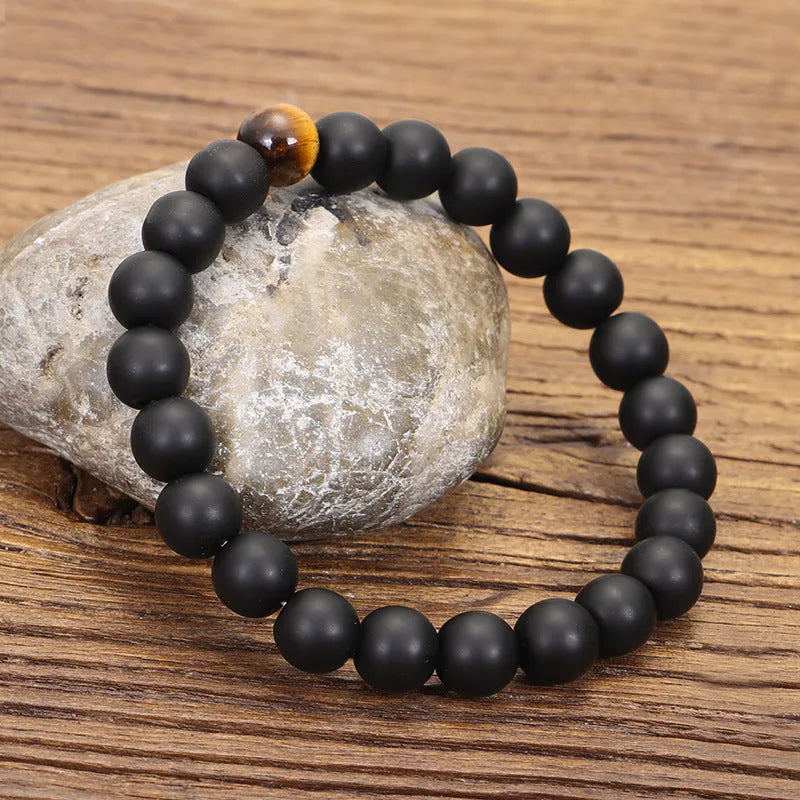 Tigereye stone drop pendant with tassel on long beaded necklace with matching bracelet.