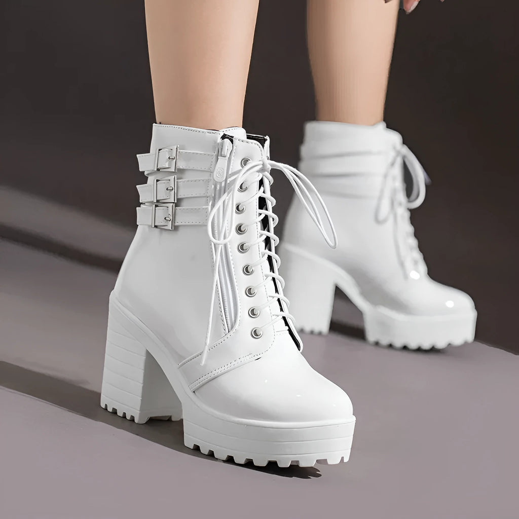 Women's black thick-heeled lace-up ankle boots with a round toe and waterproof platform sole.