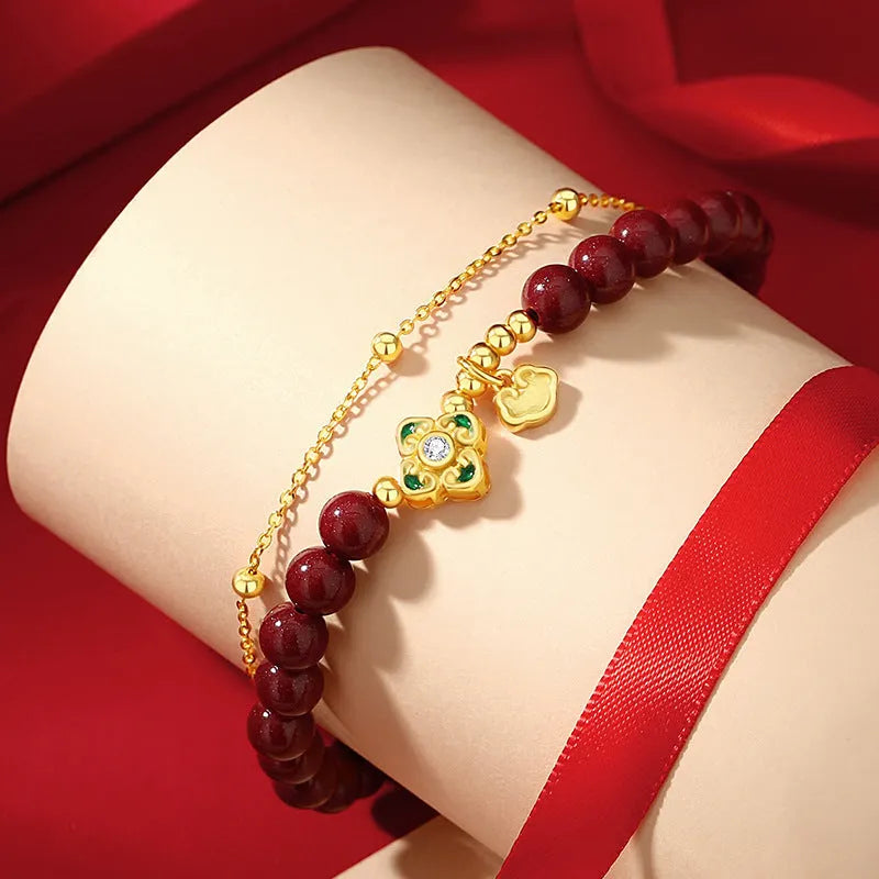 Sterling silver women's bracelet with geometric shape, Ruyi Xiangyun design, and cinnabar flower detail.
