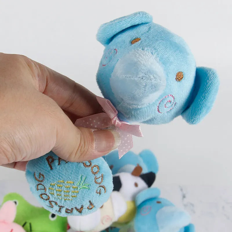 Dog plush toy with squeaker and cotton rope in animal designs including frog, elephant, cow, and bear