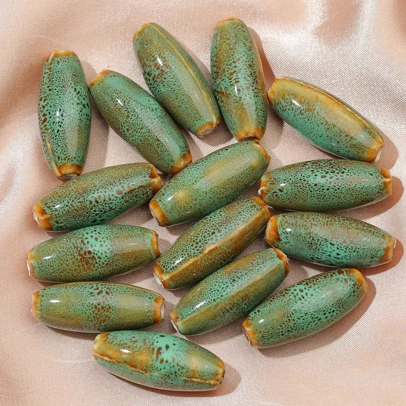 Ceramic bullet beads in seven colours for jewellery making and bracelet braiding