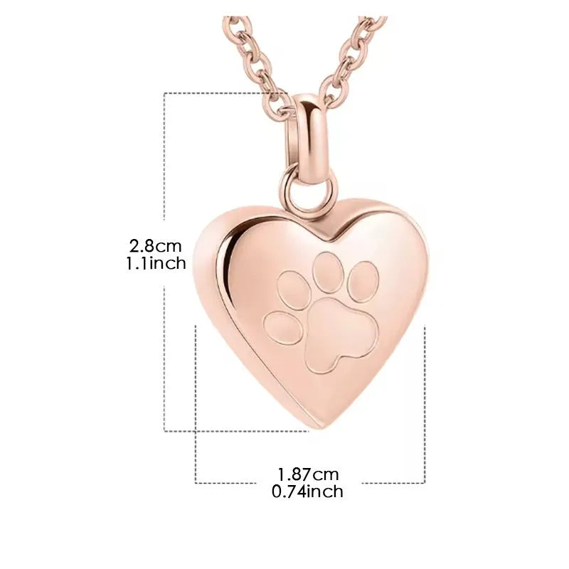 Silver titanium steel heart casket necklace with paw print design on a black background.